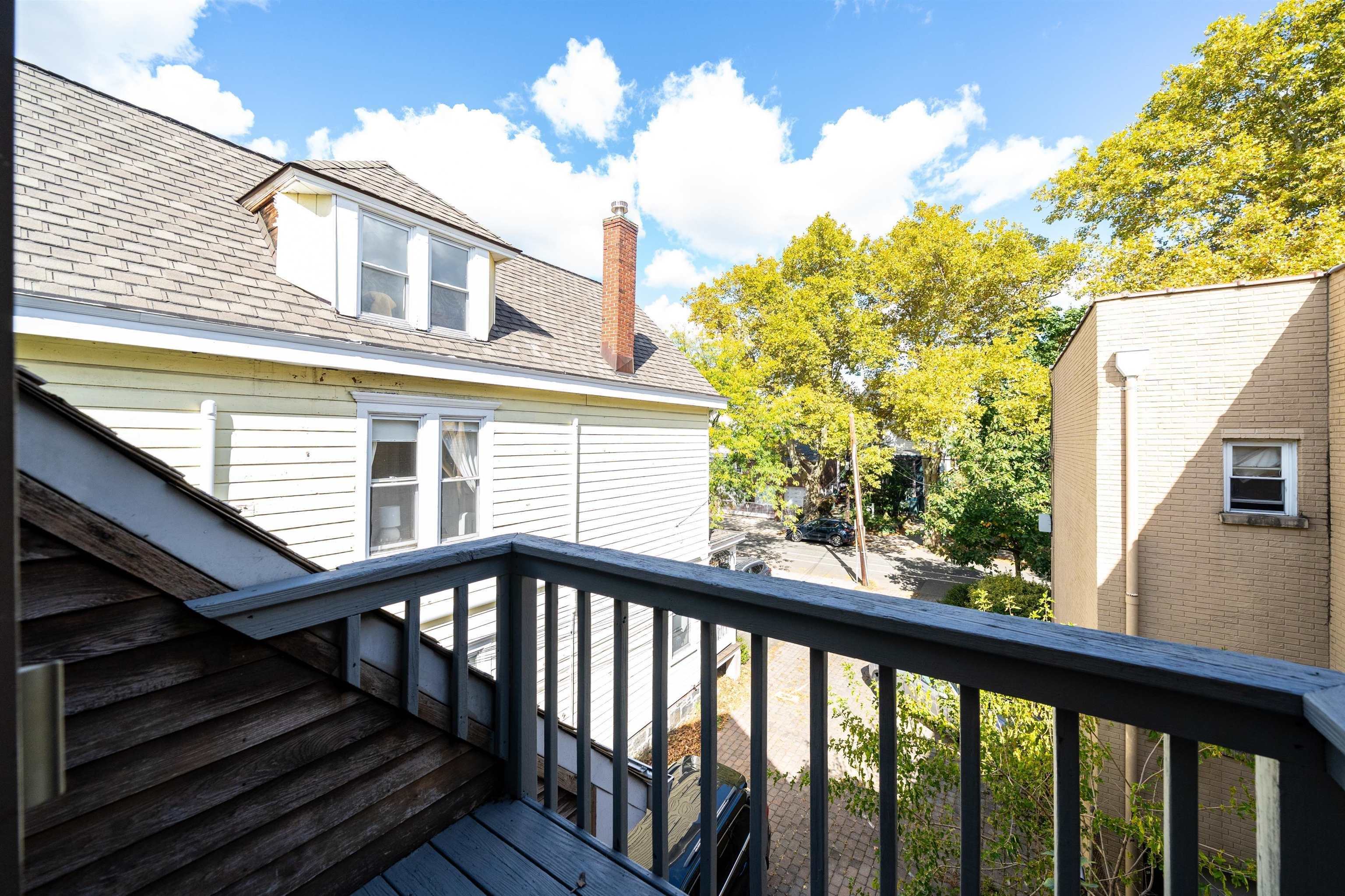 Private balcony with house and neighborhood views