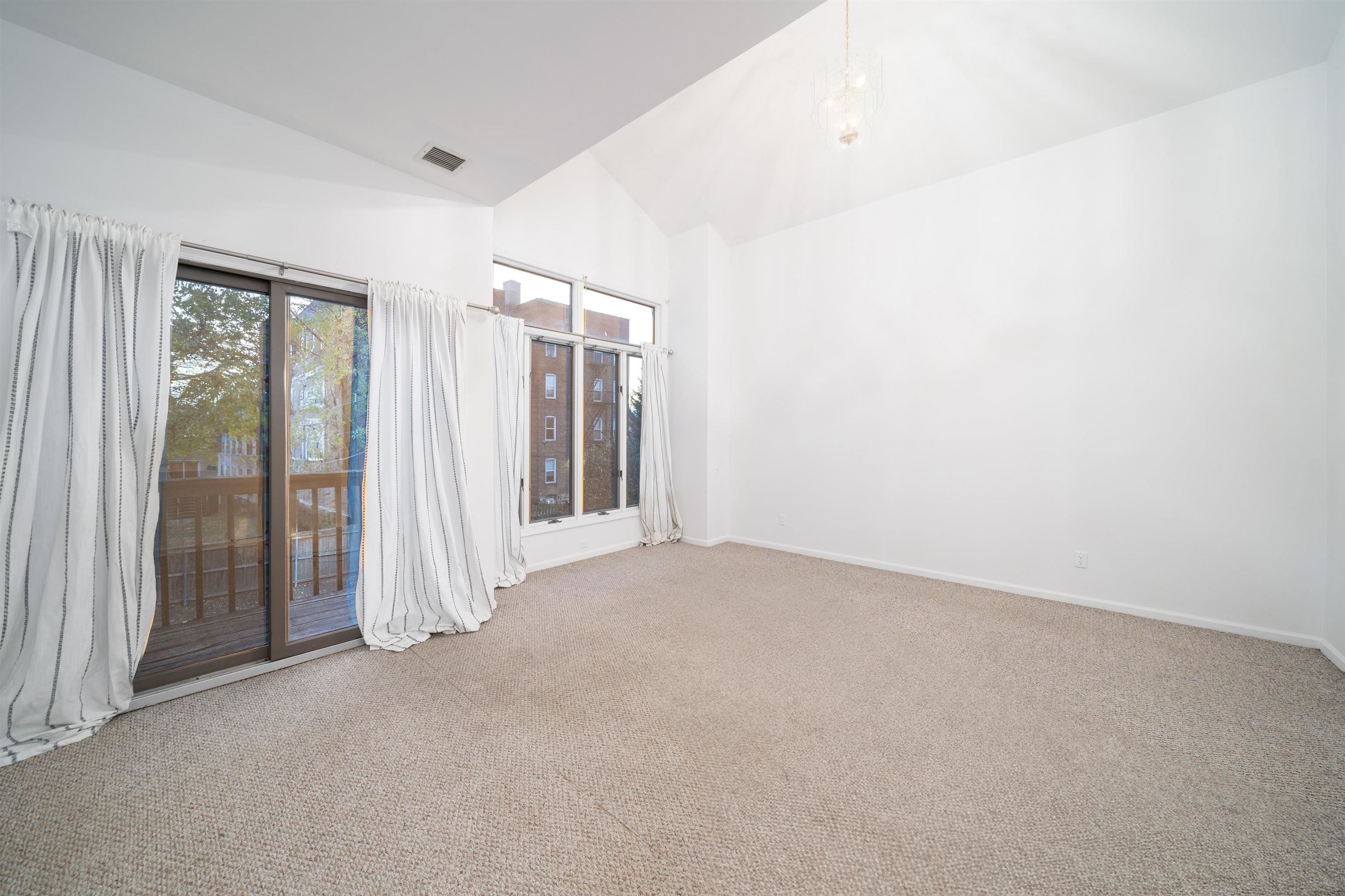 Bedroom with sliding glass doors and natural light